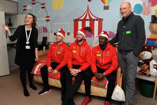 Players and staff from Fleetwood Town FC paid a festive visit to Brian House children's hospice in Bispham.
Emma Padgett shows one of the bedrooms to Conor McAleny, Chris Neal, Jordy Hiwula and Fleetwood manager Uwe Rosler.  PIC BY ROB LOCK
20-12-2017
