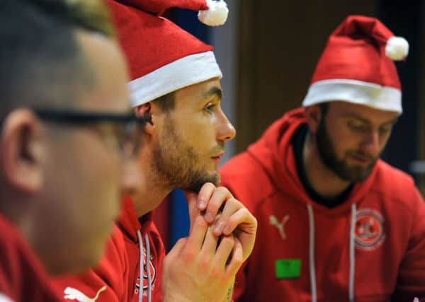 Players and staff from Fleetwood Town FC paid a festive visit to Brian House children's hospice in Bispham.
Players listen to staff.  PIC BY ROB LOCK
20-12-2017