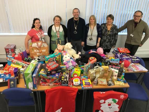 The team from Blackpool and The Fylde College with some of the gifts collected