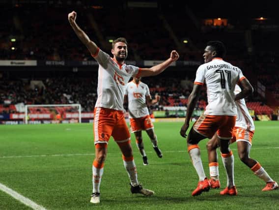 Robertson celebrates his goal