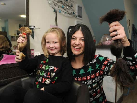Kristy and six-year-old Molly Emsley, of South Shore, had 18 inches chopped off their hair,