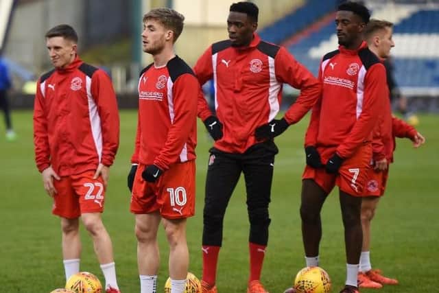 Ash Hunter, Conor McAleny, Devante Cole and Jordy Hiwula warm-up at Oldham