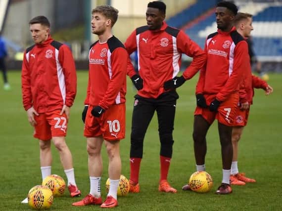 Ash Hunter, Conor McAleny, Devante Cole and Jordy Hiwula warm-up at Oldham
