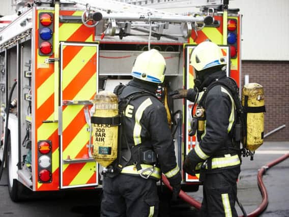 Firefighters rid a home in Blackpool from smoke following a kitchen fire.