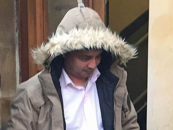 Harun Rashid, 38, leaving Blackburn Magistrates' Court where he and Mohammed Abdul Kuddus appeared charged with the manslaughter of Megan Lee