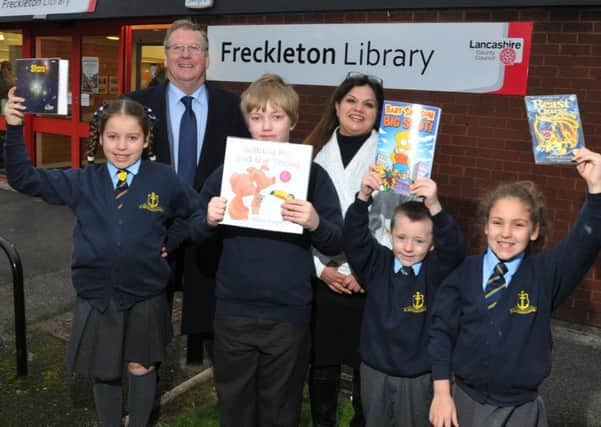 County Coun Paul Rigby and library manager Shivani Sinclair at the reopening with children from Freckleton CE Primary School from left, Sophie Hindle, nine, Rowan McGrady, nine, Alfie Hunter, six, and Lily Jones, eight