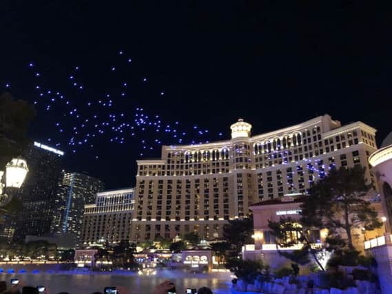 250 Intel Shooting Star mini drones taking part in a light show over the Bellagio Hotel fountain in Las Vegas