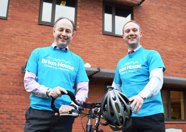 Trinity Hospice chief executive David Houston (left) and HR manager David Warburton get ready for the charity cycle ride to Paris