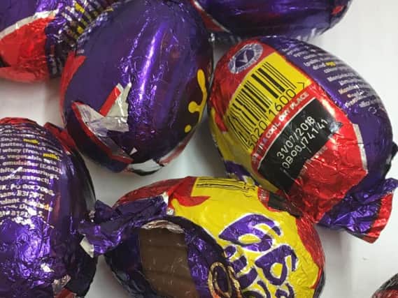Pictures show the tinfoil wrapping on eggs peeled back by customers