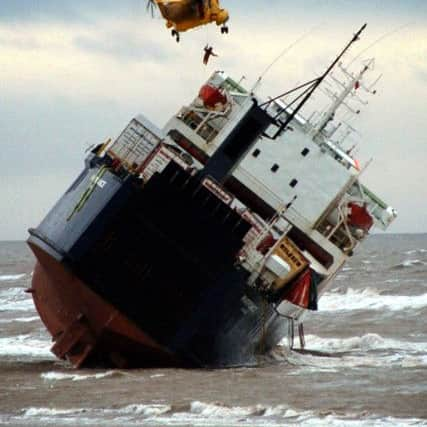 A Royal Air Force helicopter winches a man onto the deck of the Riverdance ferry in Cleveleys