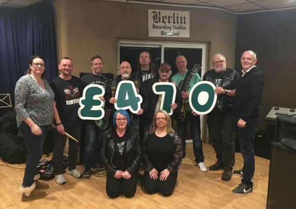 The members of Rupert Fabulous at the studio with some of Chris Higson's friends and Lisa Martin (far left)
from Macmillan

Friends gathered to pay tribute to Chris Higgy Higson, who died from cancer aged 56, when local rock band Rupert Fabulous hosted the gig at The Waterloo pub.
