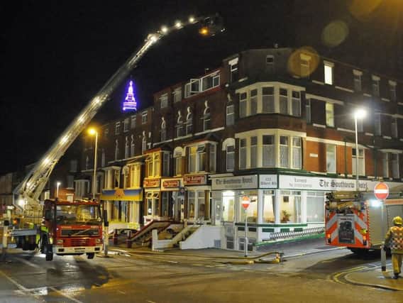 Firefighters attend a fire at the Astoria Hotel