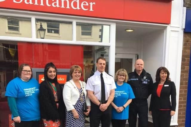Staff at the Poulton branch of Santander with Deputy Mayor, Councillor Julie Robinson and Youth Mayor, Jessica Basquill.