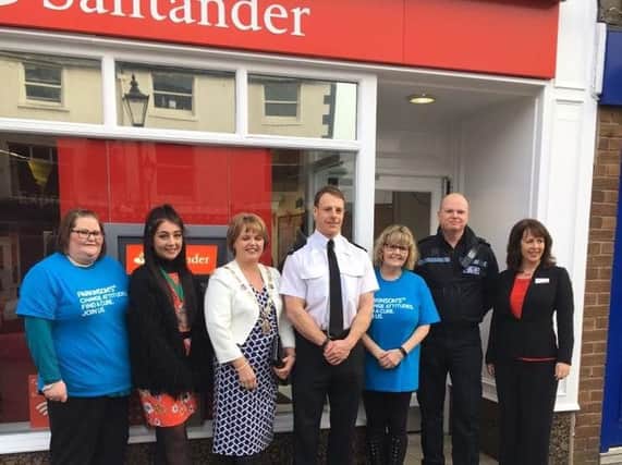 Staff at the Poulton branch of Santander with  Deputy Mayor, Councillor Julie Robinson and Youth Mayor, Jessica Basquill.