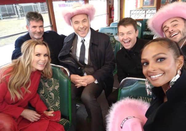 The Britain's Got Talent team, from left, Amanda Holden, Simon Cowell, David Walliams, Declan Donnelly, Alesha Dixon and Ant McPartlin, on a Blackpool heritage tram