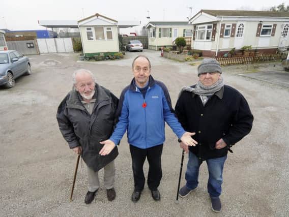 From left,  Ralph Carte, Steven Roy Gratrix and Terry Duran from the Windmill Park Residents Association.