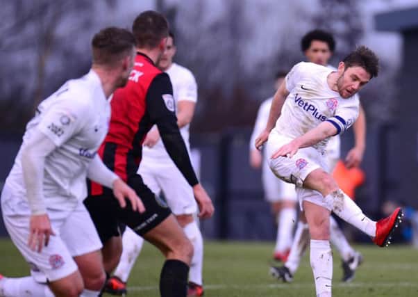 Sam Finley scores AFC Fylde's third goal against Macclesfield Town Picture: Steve McLellan