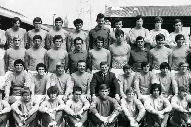 Seated centre front, Jimmy Armfield captains Blackpool Football Club in the 1970 - 1971 season
Back row l-r Steve Harrison, Rob Thomas, Dennis Wann, Bill Bentley, Dave Hatton, Johnny Johnston, Alan Taylor, John Hughes, John McNicholas, Stuart Parker, Sean Suddards, Willie McGrotty.
Second back row l-r Mr Vin Conboy (physiotherapist), Mr Jimmy meadows (assistant trainer), Martin Capes, Peter Suddaby, Glyn James, John Craven, Harry Thompson, Alan Suddick, Graham Rowe , Adam Blacklaw, Terry Alcock, Peter Nicholson, Mr Len Graham (trainer), Clive Nattress, Mr Paddy Sowden (youth coach.
Seated l-r Greg Moore, Fred Pickering, John Murray, Tony Coleman, Jimmy Armfield (captain), Mr Les Shannon (manager), Tony Green, Henry Mowbray, Ronnie Brown, Tommy Hutchison, 
Seated on ground l-r John Curtis, Steve Wojciechowicz, David Allison, Albert Garland, Gregson, Ainscow, Masson, Coogan, Morris  (first names not given for last five)