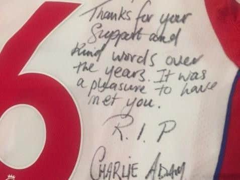 Former Pool player Charlie Adam wrote a touching message to Jimmy Armfield on the back of a Stoke shirt, which was left by his statue in Bloomfield Road.   It read: "Jimmy, Thanks for your support and kind words over the years. It was a pleasure to have met you. RIP. Charlie Adam"
