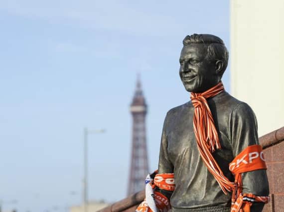 The statue of Jimmy Armfield has become a shrine to the great man. Photo: Dan Martino