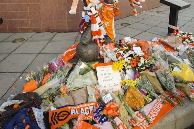 Wellwishers have left scores of tributes to Jimmy Armfield at his statue at Bloomfield Road