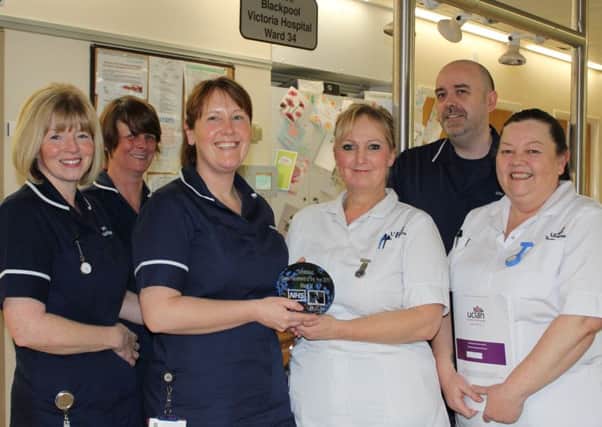 Lindsey Kelsall, left and Sharon Meadows, fourth from left with
staff from Ward 34 and the NMC Mentors award
Blackpool Teaching Hospitals NHS Foundation Trust