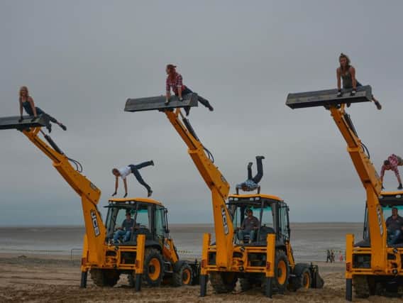The dancing diggers on the beach at Fleetwood's SpareParts Festival in 2014
