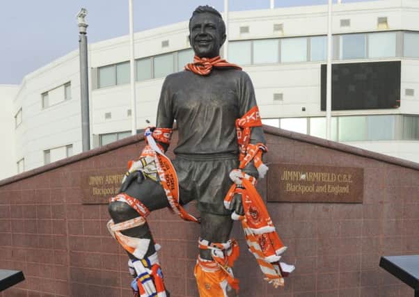 Tributes have been left at the Jimmy Armfield statue at Bloomfield Road
