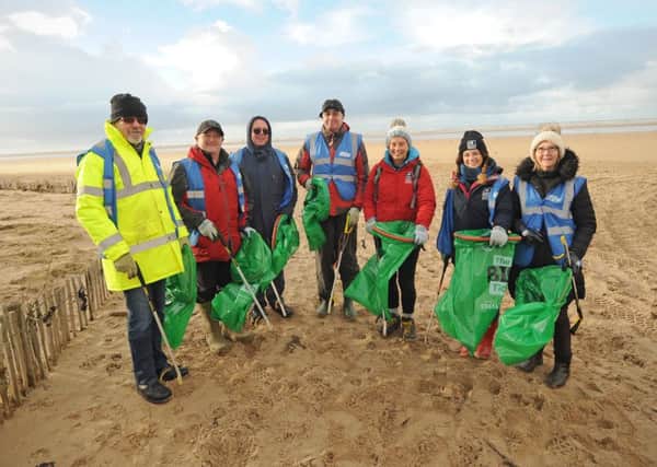 St Annes North Beach Care volunteer group litter picking on the beach