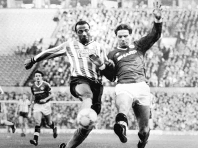Cyrille Regis in action for Coventry battling with Manchester United's John Sivebaek (photo: PA)