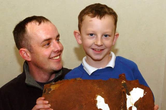 Eight year old Justin Randles and Kieron Randles, with their piece of the Riverdance ferry.