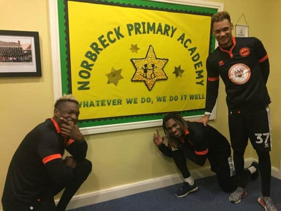 Dolly Menga, Armand Gnanduillet and Christoffer Mafoumbi go back to school