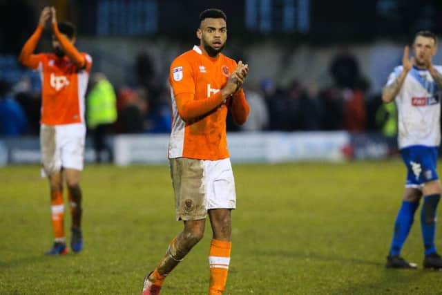 Old boy Peter Clarke joins in with the applause for the travelling Blackpool fans at full time