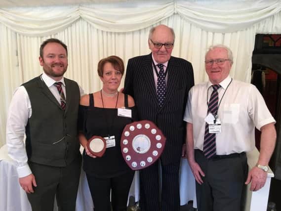 Left to right, Kenny Humphreys (Chair of NWCSG), winner Claire Oakes (SHEQ Director, Create Construction), Lord Brougham & Vaux, Philip Grundy
(Committee member of NWCSG and representative of Safety Groups UK).