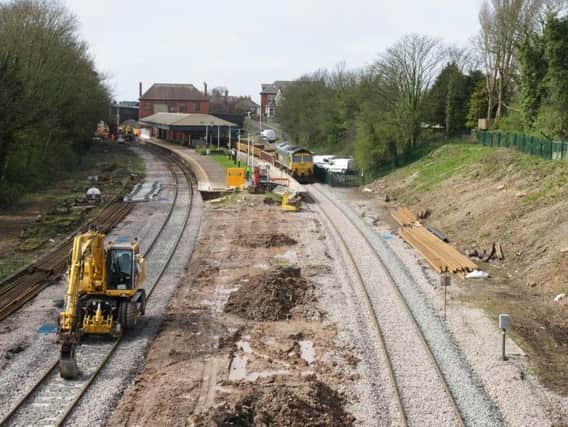 Paul Nettleton's photograph showing work starting at Poulton station. The former, longer length of the platforms can be seen.