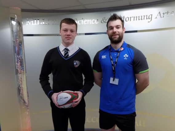 Lewis Bates (left) with the schools rugby coach, Richard Byrne