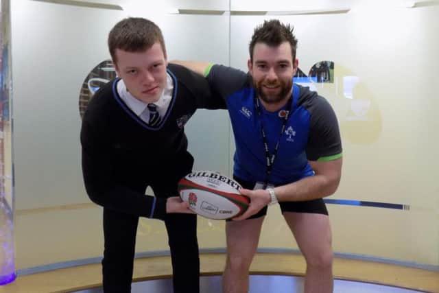 Lewis Bates (left) with the schools rugby coach, Richard Byrne