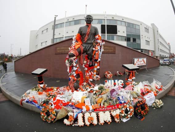 Tributes left at the Jimmy Armfield statue at Bloomfield Road in Blackpool
