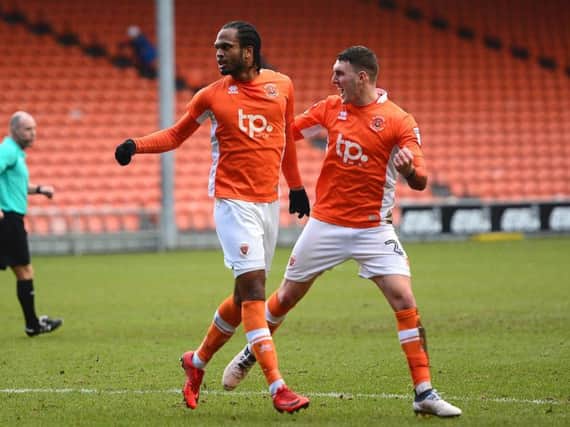 Nathan Delfouneso celebrates drawing Blackpool level in the first half