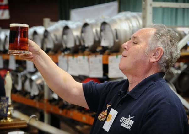 Fleetwoods Marine Hall hosted the 36th CAMRA real ale and cider festival.Festival Chairman Gary Levin checks a brew for clarity