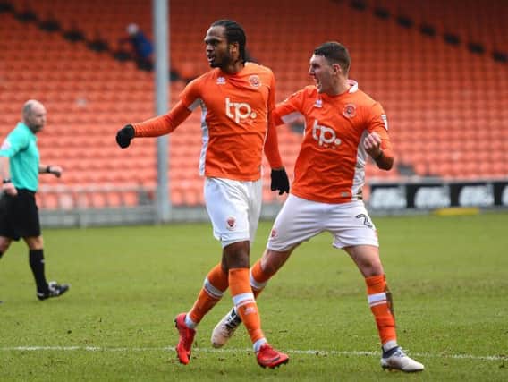 Delfouneso celebrates his goal against Walsall with Cooke