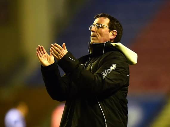 Gary Bowyer applauds the Blackpool fans at the end of the match