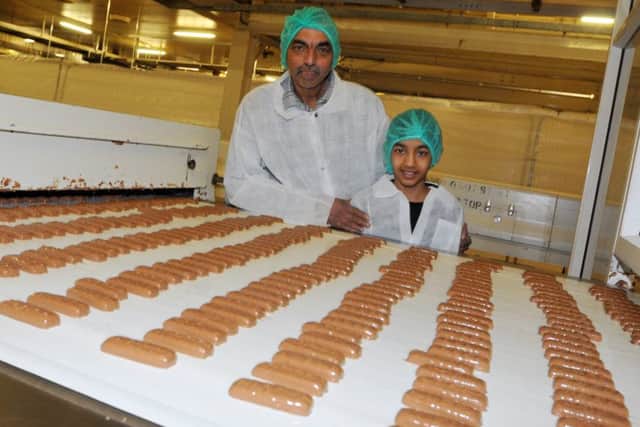 Arun Chauhan, who has worked at the factory for 30years, is pictured with Tristan Anthony, 11.
