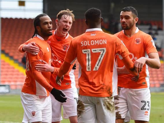 Blackpool celebrate after Nathan Delfouneso draws them level in first-half injury time