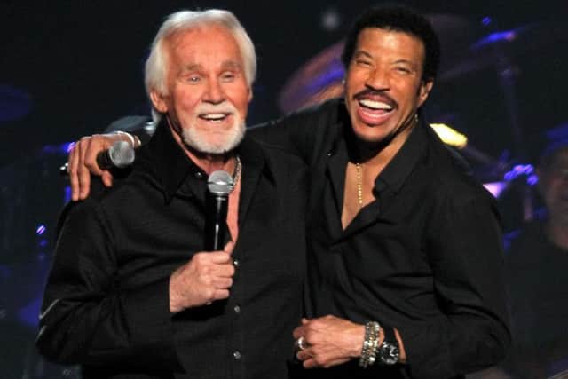 Kenny Rogers, left, with Lionel Richie