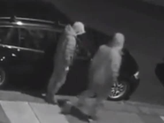 The pair were allegedly seen trying car doors - and were caught on CCTV (Picture: Blackpool Police)