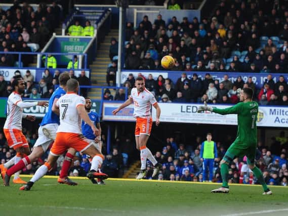 Clark Robertson heads past Luke McGee for Blackpool's second goal