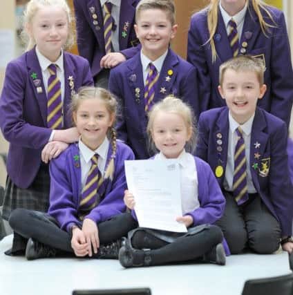 Lytham Hall Park Primary School is on the verge of being rated outstanding by Ofsted.  Pictured are Harry Craig, 9, Eleanor Channon, 11, Poppy Rowlings, 10 and Declan Aspery, 10, Joshua Squires, 10 and sisters Emma and Sophie Condon-Tomlinson, aged 9 and 5.