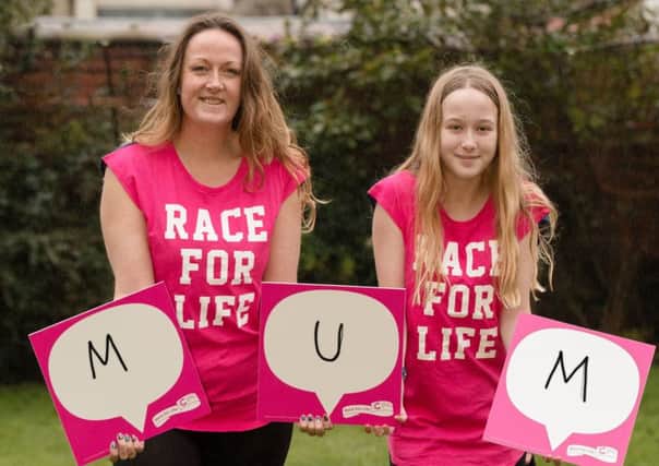 Image attached showing Jenny Clarke, aged 40, and daughter Lily Webber, aged 12 from St Annes. They are holding up Race for Life back signs spelling out the word mum as they encourage other mums and daughters to sign up to Cancer Research UKs Race for Life events in Blackpool and help raise money for vital, life-saving cancer research. Jenny lost her mum Carole to breast cancer in 2013.