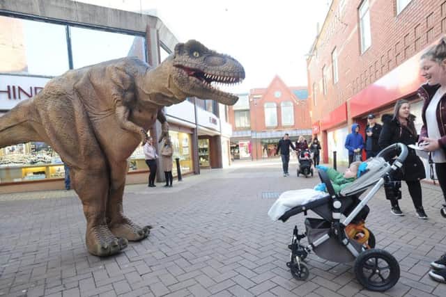 A T-Rex paraded the streets to promote the upcoming Dinosaur World Live show